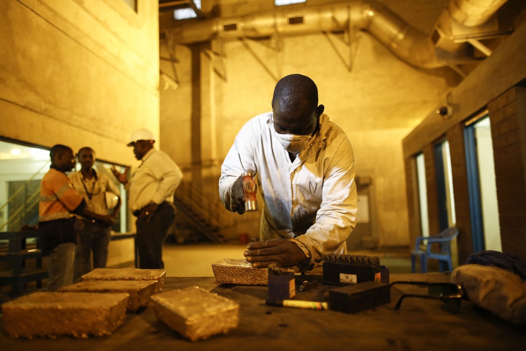 Modern African gold refinery facility showing the five-step refining process from doré reception to finished 999.9 fine gold bars ready for commercial buyers.